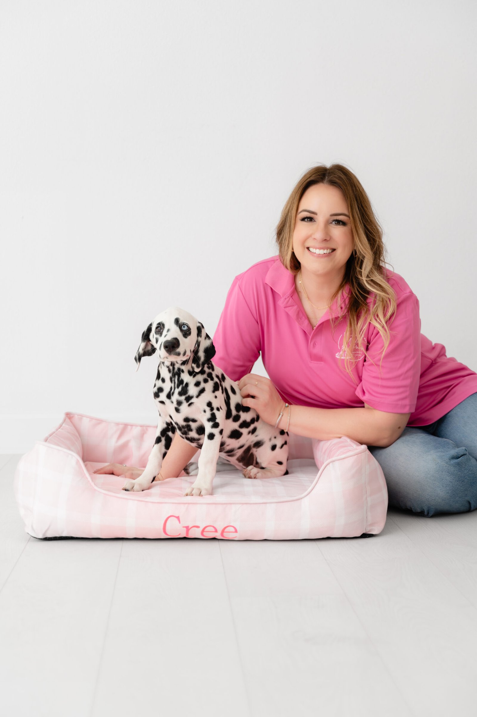 Owner of Maid for Muddy Paws with Dalmatian dog representing pet-friendly residential cleaning services in Magnolia Texas